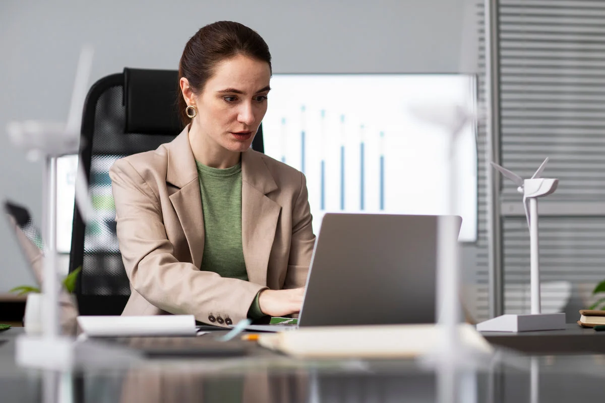 A professional reviewing health insurance paperwork at a desk